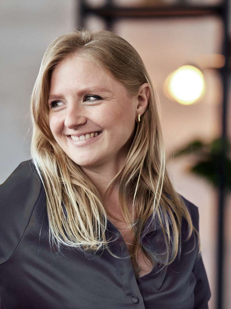 Kerstin looks at the camera intensely with a small smile.